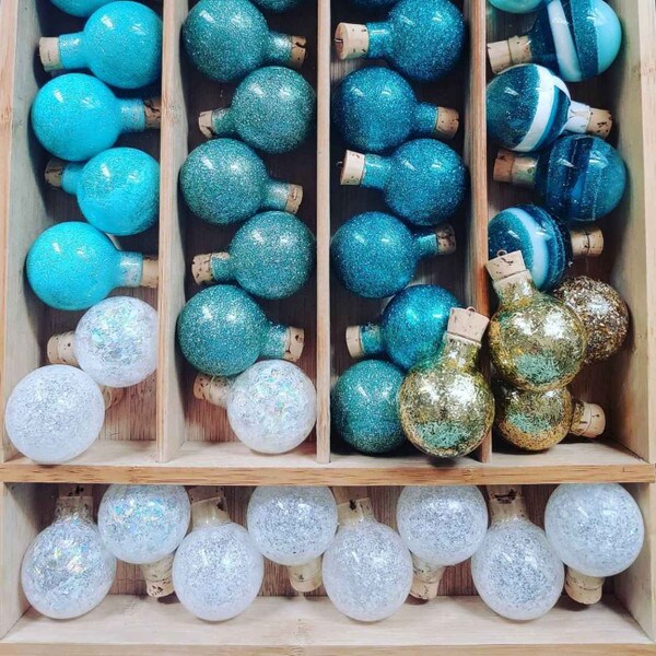 small tapered corks in handmade blue, white and gold glitter holiday bulb ornaments by KKennedy Designs